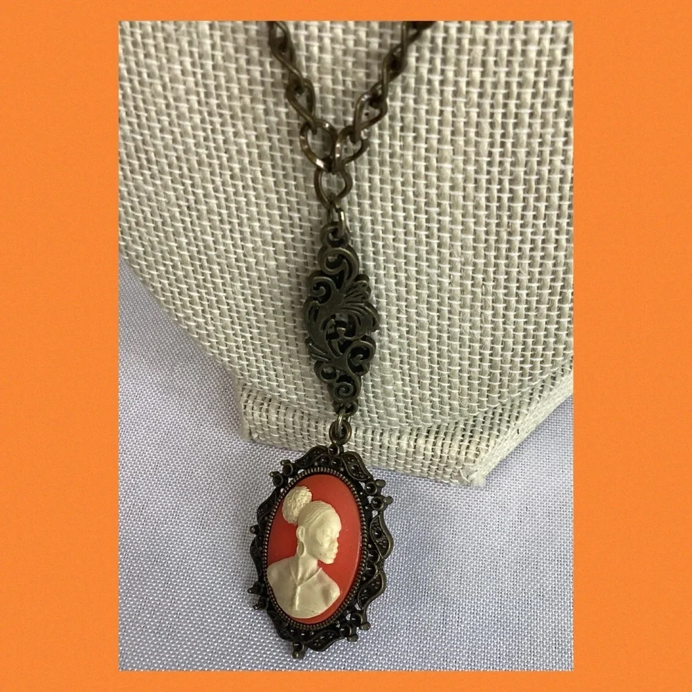 Orange and bronze cameo necklace.